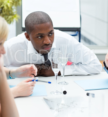 Ethnic businessman in a meeting celebrating a success