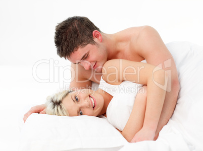 Couple in love lying in bed