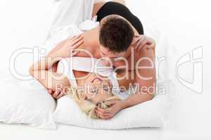 Romantic couple lying on bed