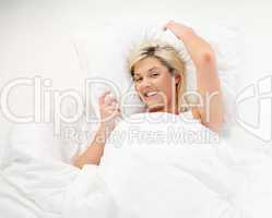 Smiling girl resting in bed