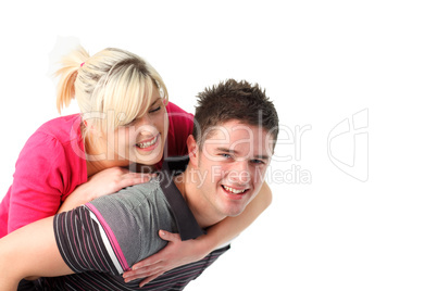 Boy giving his girlfriend piggyback ride