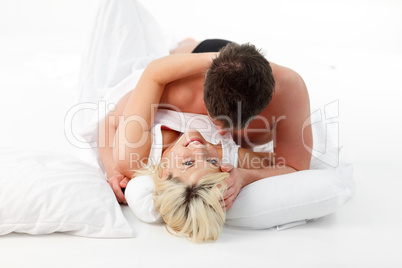 Young couple in love resting in bed