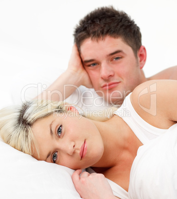 Portrait of a couple lying in bed