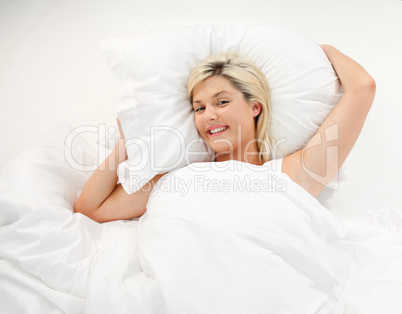 Happy girl resting in bed