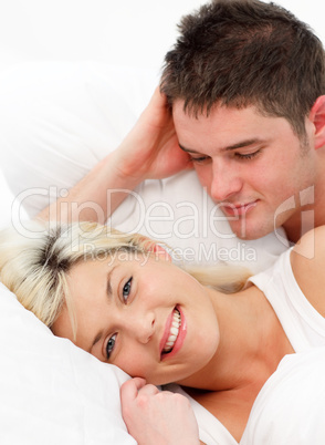 Smiling girl lying with her boyfiend