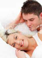 Smiling girl lying with her boyfiend