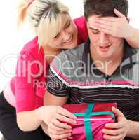 Portrait of a girl giving her boyfriend a gift