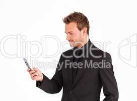 Attractive businessman sending a text