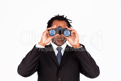 Businessman looking through binoculars