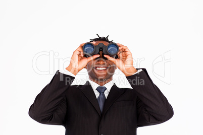 Handsome businessman holding binoculars upwards