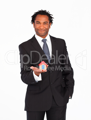 Afro-american businessman presenting house