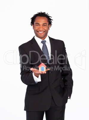 Businessman with house for real estate concept
