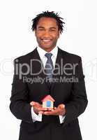 Friendly businessman showing constructions of house