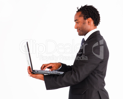 Friendly businessman working on laptop