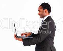 Friendly businessman working on laptop