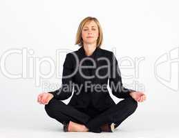 Mature businesswoman meditating with clossed eyes