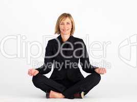 Businesswoman doing yoga exercises
