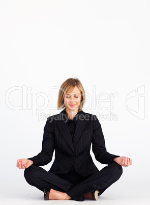 Businesswoman doing yoga with copy-space