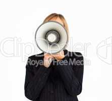 Closeup of a businesswoman with a megaphone hiding her face