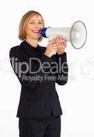 Businesswoman with a megaphone smiling at the camera