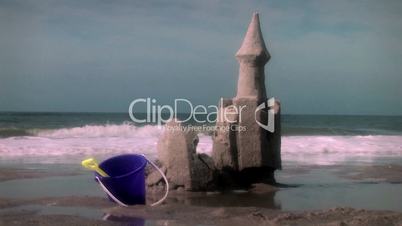 (1003) Crumbling Beach Sandcastle with Toys Summer Oceanside Vacation