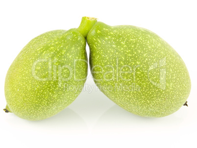 two unripe walnuts