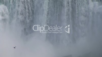 Bird flying on falling water background