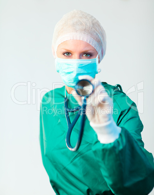 Surgeon holding stethescope outwards