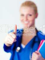 Doctor with thumb up to camera