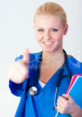 Doctor with her thumb up with focus on face