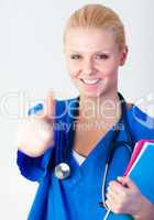 Doctor with her thumb up with focus on face