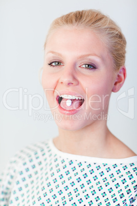 Patient with a pill in her mouth