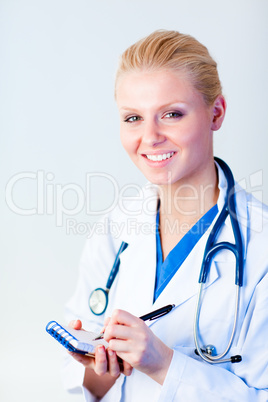 Female doctor writing a perscription