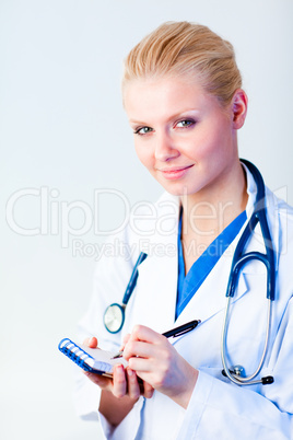 Female doctor writing a perscription