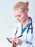 Female doctor writing a perscription