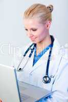 Young Female doctor working on a laptop