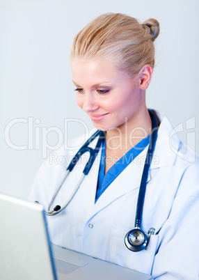 Young Female doctor working on a laptop