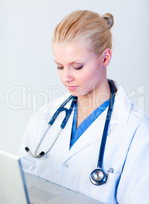 Young Female doctor working on a laptop