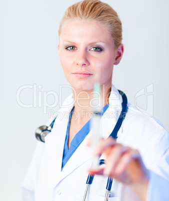 Serious Doctor holding a needle with hint of a smile