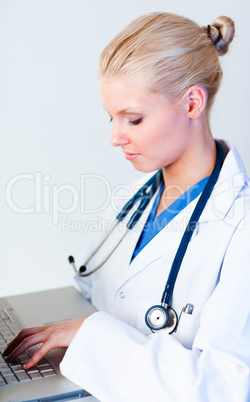 Young Female doctor working on a laptop