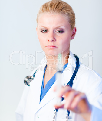 Serious Doctor holding a needle