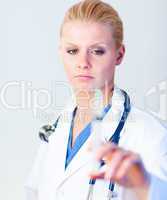 Serious Doctor holding a needle
