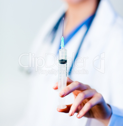 Doctor holding a needle