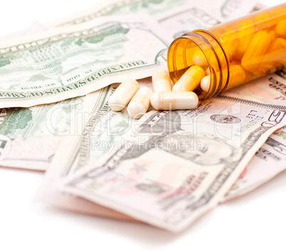 Pills and Dollars on white background