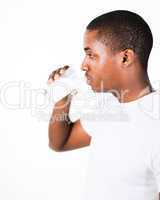 Man drinking a glass of Milk