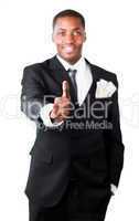 Happy businessman with dollars in a pocket showing thumb up