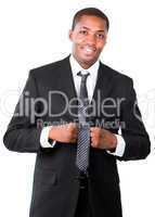 Portrait of Afro-American businessman correcting a tie