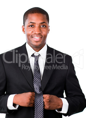 Happy businessman correcting his tie