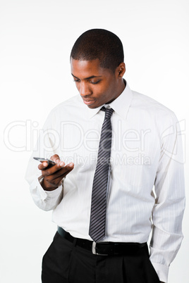 Young businessman sending a text message