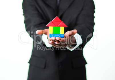 Close-up of an businessman presenting a sample of a house